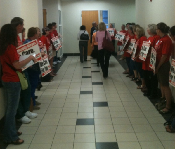 Nurses line the halls.