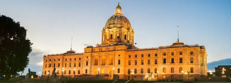 Minnesota State Capitol lit up at dusk.