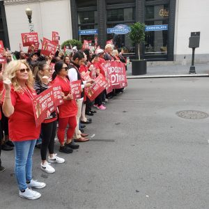 Nurses protesting in a street. 